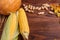 Composition of autumn vegetables on a brown wooden background