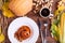 Composition of autumn vegetables on a brown wooden background