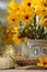 Composition with beautiful flowers, pumpkins and book on table. Autumn atmosphere