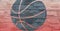 Composition of black basketball ball stencil design over textured red stone wall background