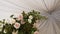 Composition bouquet of white rose flowers on the roof tent