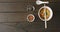 Composition of bowl of pad thai with soy sauce and chopsticks on wooden background