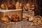 Composition with bread and rolls in wicker basket.