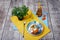 A composition of breakfast. Bowl of ice cream, tiny tree, bottle of apricot juice on a table background. Healthy brunch.