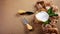 Composition Camembert or brie cheese circle, decorated with basil, on old ragged fabric, Cheese Serving Knife. top view image with