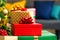Composition of christmas tree and stack of presents on blurred background