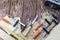 The composition of the clips, chisels, and chips on the desktop in the wood workshop.