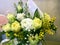 Composition with Colorful flowers. Flowers yelloe tulip, white ranunculus, yellow mimosa. Flowers close up isolated on background