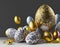 Composition of coloured and golden eggs, with artistic decorations, with depth of field, photographic lighting and close-ups.