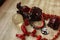 Composition of a crimson horse figurine, red beads made of natural coral, a bracelet with a yin yang symbol, a transparent ball, a