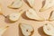 Composition of cut pears on a beige background. Top view