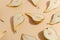 Composition of cut pears on a beige background. Top view