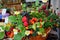 Composition from different berries and flowers in a street shop of jam and compotes