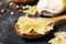 Composition of different varieties of pasta and cherry, spices on a black background. top view. Place for text.