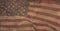 Composition of distressed, aged, dirty, vintage billowing american flag