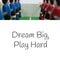 Composition of dream big, play hard text over close up of football table game