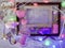 Composition of empty frames, Christmas decor, a pair of pigs, felt hearts, candles, illuminations, pink coloring