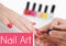 Composition of fashion and beauty text over woman painting nails