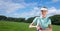 Composition of female golf player holding club outdoors