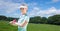 Composition of female golf player holding club outdoors