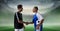 Composition of football captains shaking hands over sports stadium