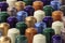 Composition in foreground of several rows of espresso coffee capsules arranged in diagonal