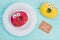 Composition with funny donuts on wooden background.