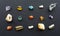 Composition of gems, crystals and minerals of different geological rocks on a black background. A collection of semiprecious