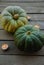 Composition of green pumpkins and candles