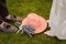 Composition of grooms and bride legs, hat and bouquet of lavender