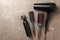 Composition hairdresser accessories on gray background, top view