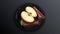 Composition of half an apple and cinnamon on a plate.