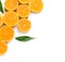 Composition with halves of ripe tangerines and leaves on white background, top view. Citrus fruit