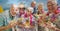 Composition of happy senior holiday group holding drinks, smiling on beach and autumn foliage