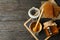 Composition honeycombs, honey, jars and dipper on wooden background