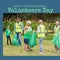 Composition of international volunteer day text and diverse group of volunteers recycling plastic