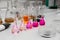 Composition of laboratory material with colored liquids in realistic glass pots