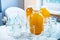 Composition of a large number of jars and three jars of honey standing on a white table against a background of light