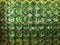 Composition made of green bottles seen from the bottom of the bottle