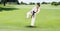 Composition of male martial karate artist with black belt practicing in park with copy space