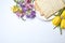 Composition with matzo and flowers on white background, top view.