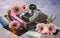 Composition with an old camera, a photo album, color photos and pink gerbera flowers.World Photography Day, August 19