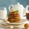 Composition with pancakes milk and cocoa drink on wooden table. Sweet breakfast