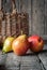 Composition with Pears on the dark wooden table