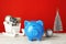 Composition with piggy bank and Christmas decor