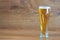 composition of pilsner glass with delicious clear beer o