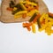 Composition of raw pasta uncooked tricolore fusilli, pasta twist shape. Close up and selective focus on colorful fusilli pasta