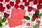 Composition of red roses, chocolates, sequins hearts, envelopes, candles on white background. Content for Birthday, Valentines Day