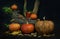 Composition of ripe orange pumpkins, clusters of red mountain ash and colorful autumn leaves