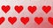 Composition of rows of read hearts moving on pink background